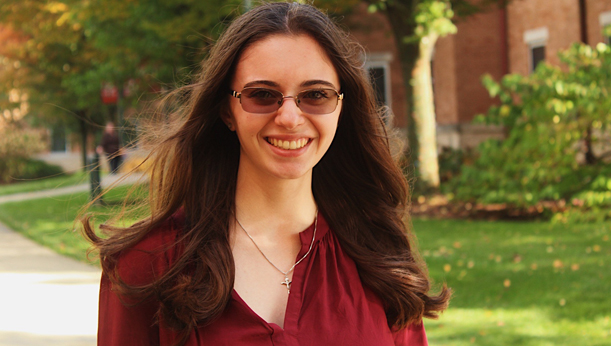 English Professional Writing Student stands outside of Bold Hall on the La Roche University campus.